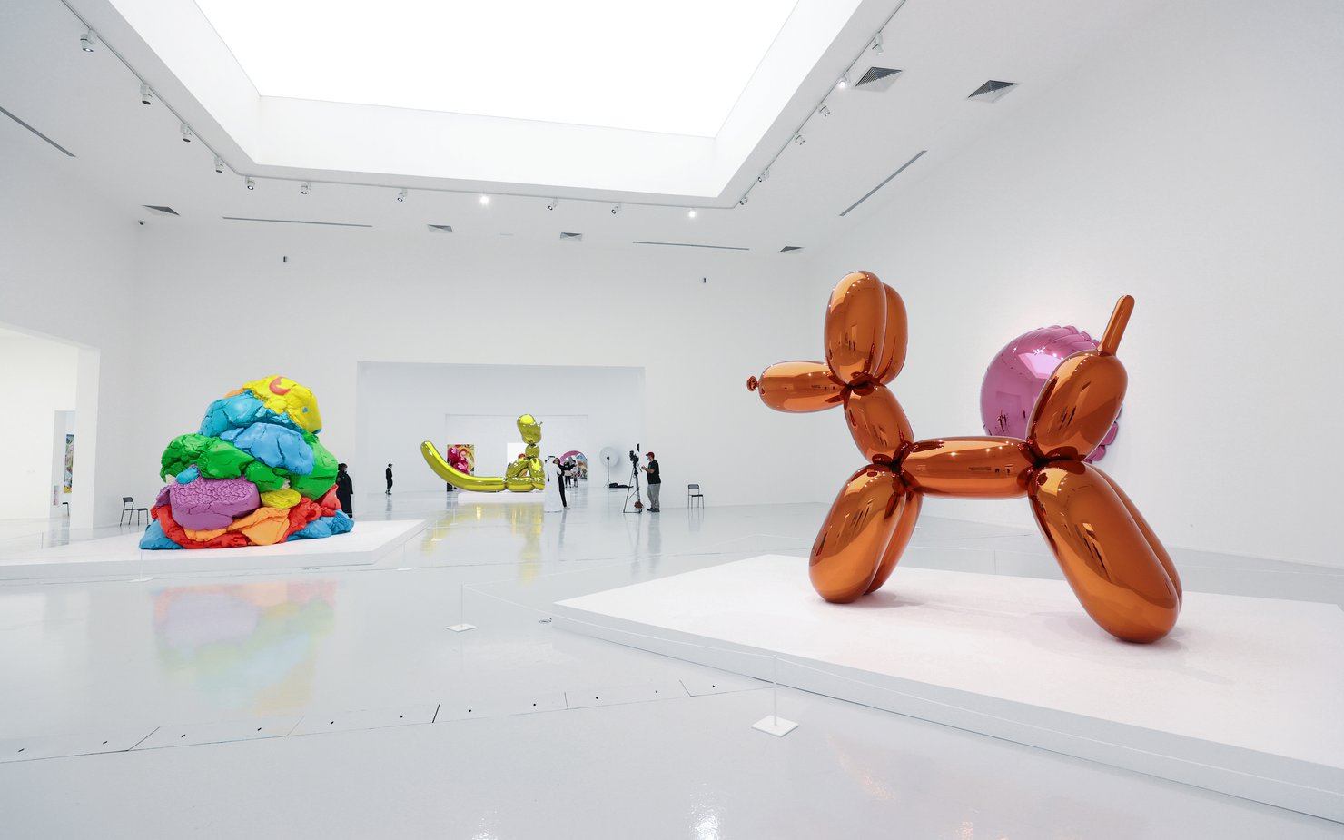 Visitors inside the galleries of the exhibition Jeff Koons: Lost In America