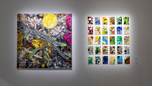 A painting of colourful flowers and foliage, next to it is another artwork that consists of mini abstract postcards arranged in the shape of a square.