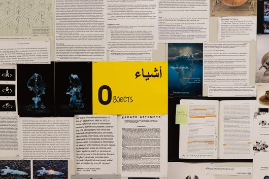A collection of documents surround a yellow paper in the middle that has the word 'Objects' written on it.