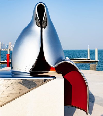 Abstract silver reflective sculpture of a Gulf woman
