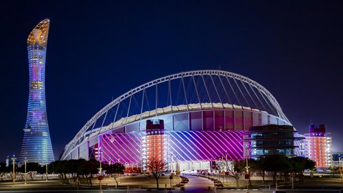 3-2-1 Qatar Olympic Sports Museum illuminated at night with brightly coloured lights