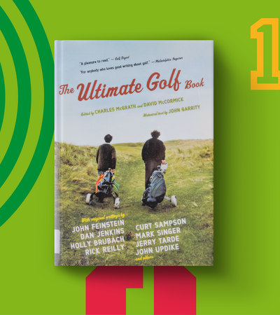Book cover displaying two men carrying golf carts with a title "The Ultimate Golf Book"