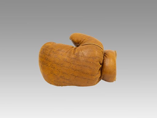 Boxing glove (left hand), 1960 Signed by Cassius Clay (Muhammad Ali)