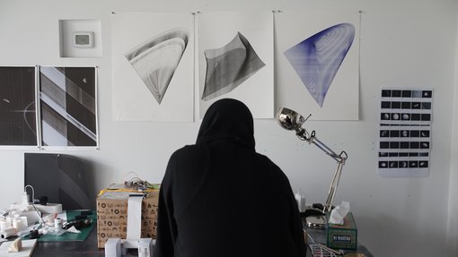 Artist Eman Makki working in her studio.