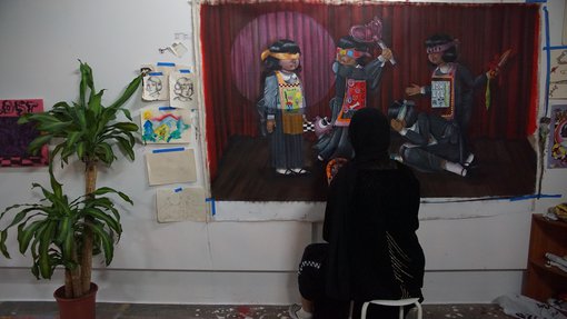 Artist Maryam Alameri working in her studio.