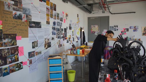Artist Nourbanu Hijazi working in her studio at the Fire Station.