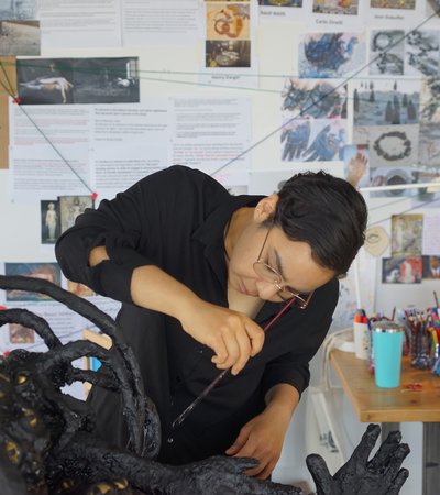Nourbanu Hijazi working in her studio.