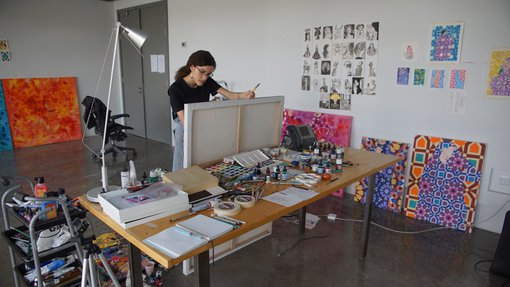 Sarah Al-Ansari working in her studio at the Fire Station.