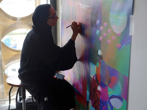 Artist in residence Shaikha Al-Hardan working in her studio.