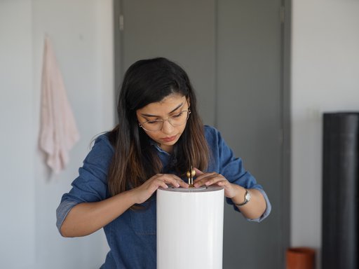 Sidra Zubairi working in her studio.