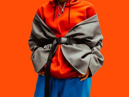 orange background with person standing