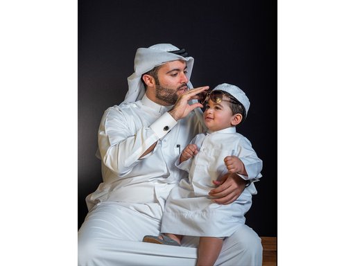Father and his son in Qatari traditional clothing