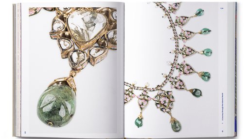 Two open pages of a book showing details of a necklace with previous stones