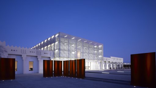 Exterior of Mathaf: Arab Museum of Modern Art lit up at night