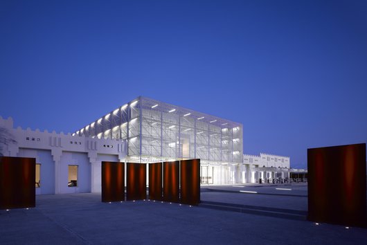Exterior of Mathaf: Arab Museum of Modern Art lit up at night