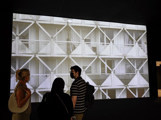 Visitors observing a digital display at Mathaf: Arab Museum of Modern Art