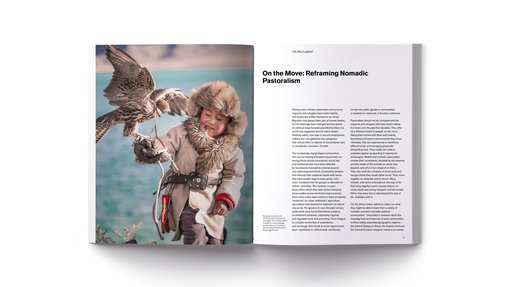 Two open pages of a book with text and an image of a child holding a falcon