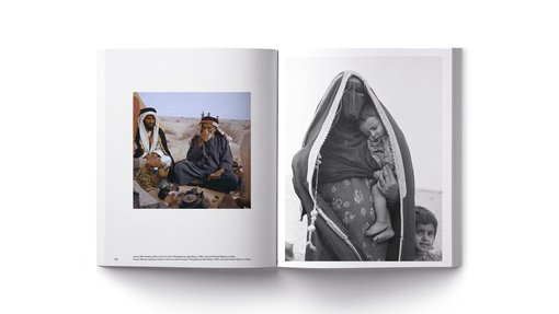 As spread with two images, one showing a woman holding a child and another of men in a gathering having Arabic coffee in the desert