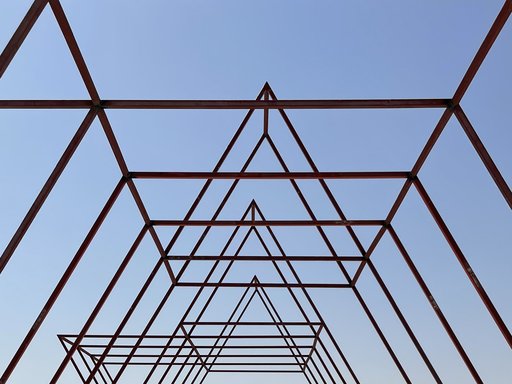 Bare structure of a shelter depicting columns formed in a symmetrical shape