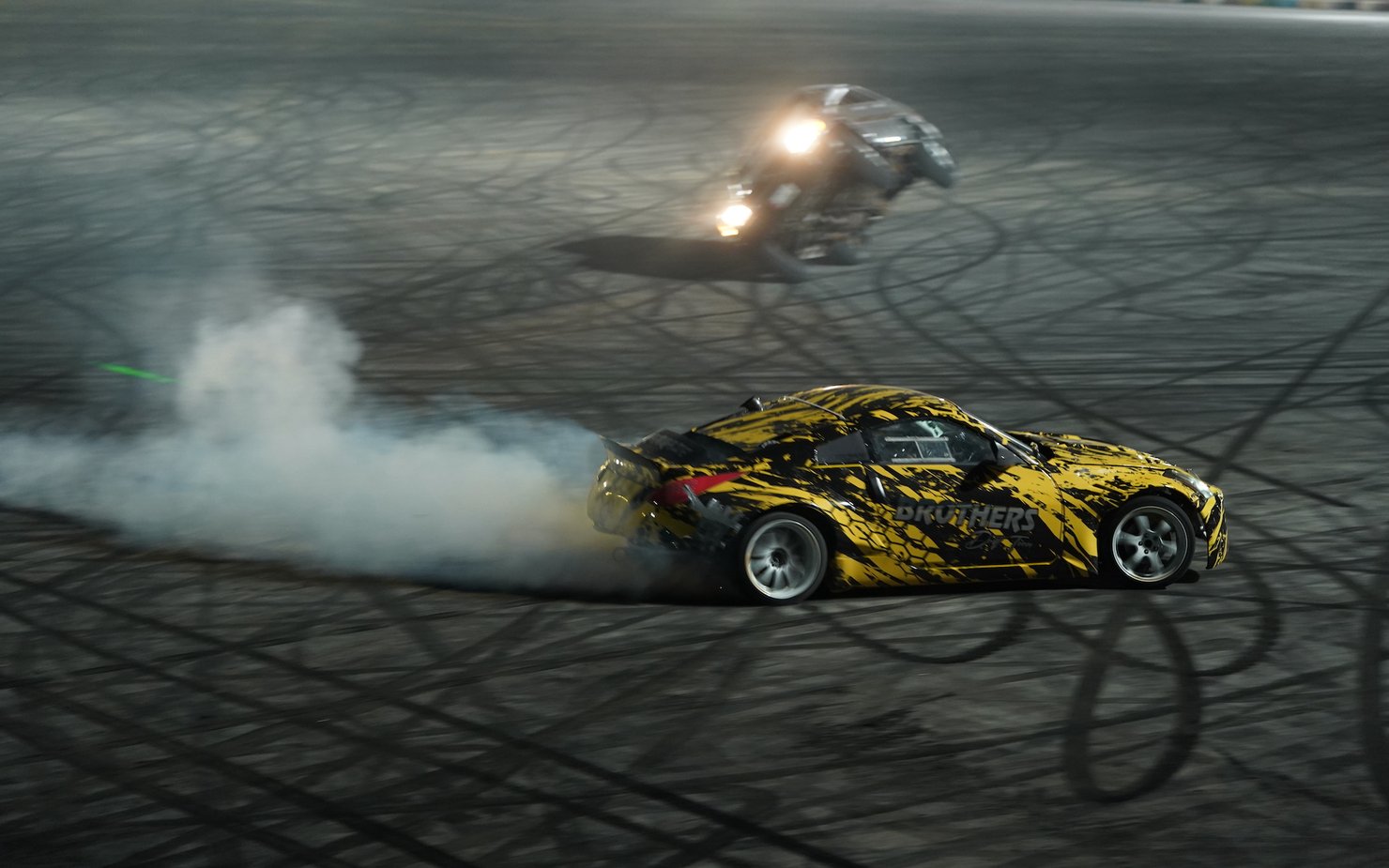 Two race cars free-style drifting in a circut