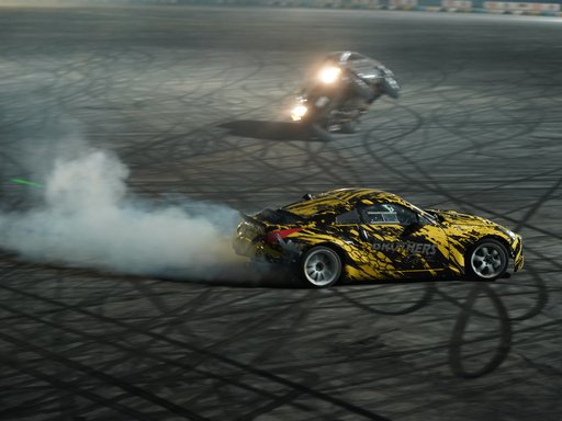 Two race cars free-style drifting in a circut