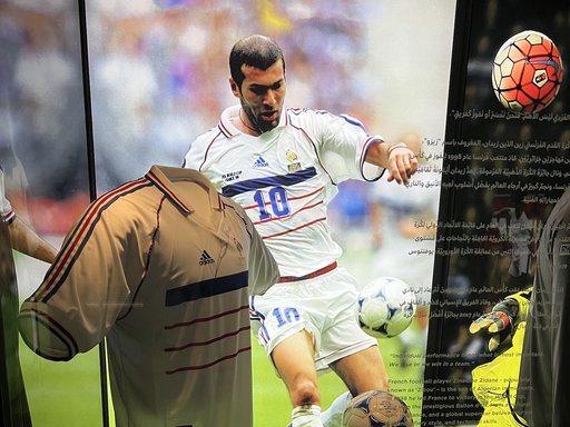 Picture of the 1998 World Cup France football shirt, signed by Zidane, in blue, white and red.