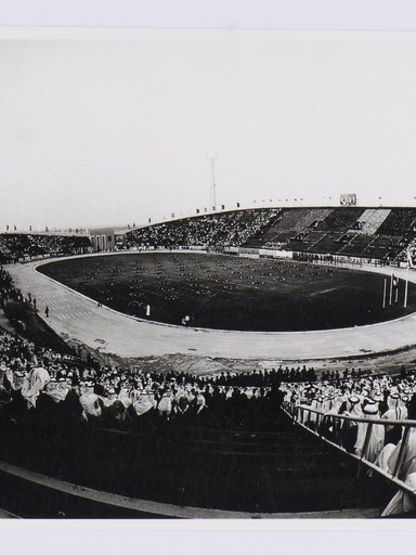 Black and white image of a stadium packed with spectators.