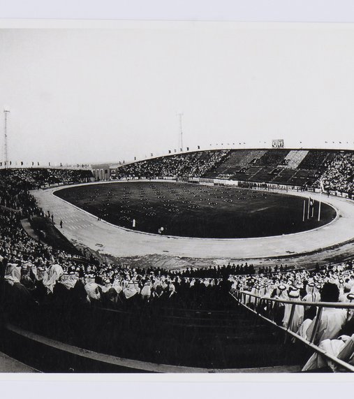 Black and white image of a stadium packed with spectators.