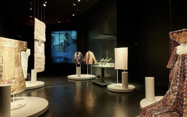 Exhibition with tapestry and dresses