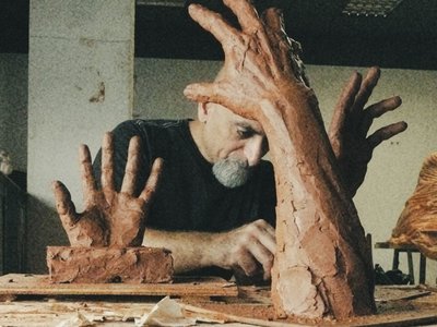 artist doing sculpture