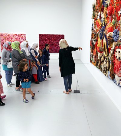 A group of school children visit Mathaf as part of the Years of Culture programme