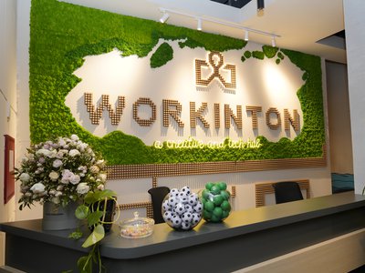 Workinton reception desk with the word workinton on the back wall.