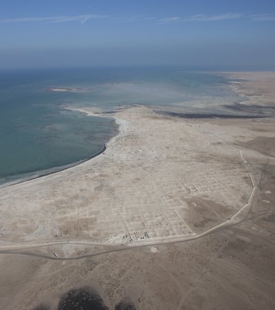 An aerial view of the Al Zubarah heritage site located right next to the coast