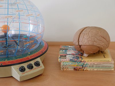 An assortment of old children's toys and books.