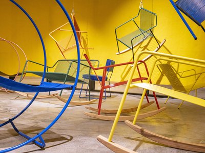 Interior view, Studio 7, colourful display of modern metal chairs