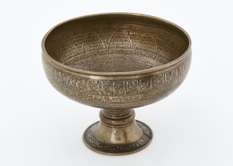 Bronze cup with silver inlay