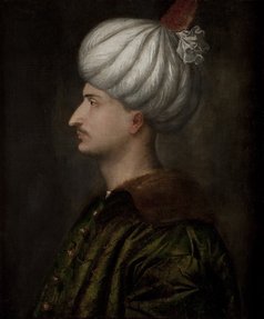 Profile of a man wearing a white turban.
