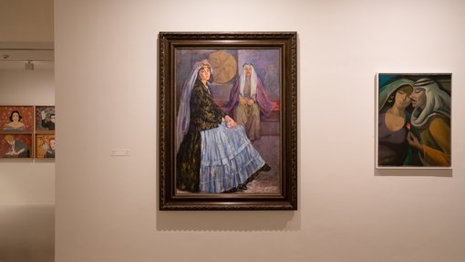 Gallery view of multiple paintings on display.