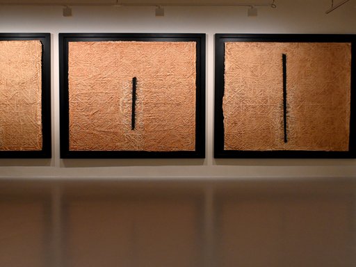 Three abstract blocks of art displayed at a museum