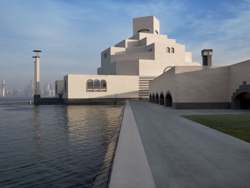 Waterside pathway to the Museum of Islamic Art (MIA) with Doha in the background
