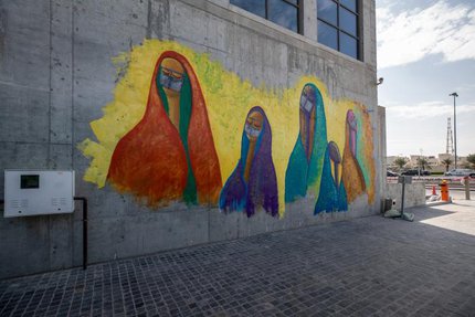 Five abstract figures of women wearing the Qatari cultural clothes known as the Abaya and Batoola.