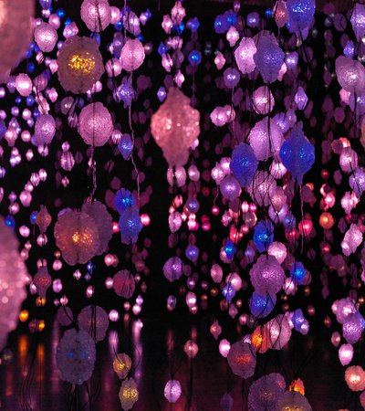 Artwork by Pipilotti Rist of hanging lights in pink, purple and blue
