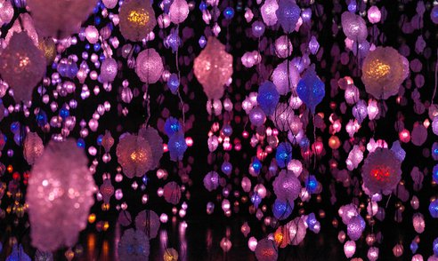 Artwork by Pipilotti Rist of hanging lights in pink, purple and blue