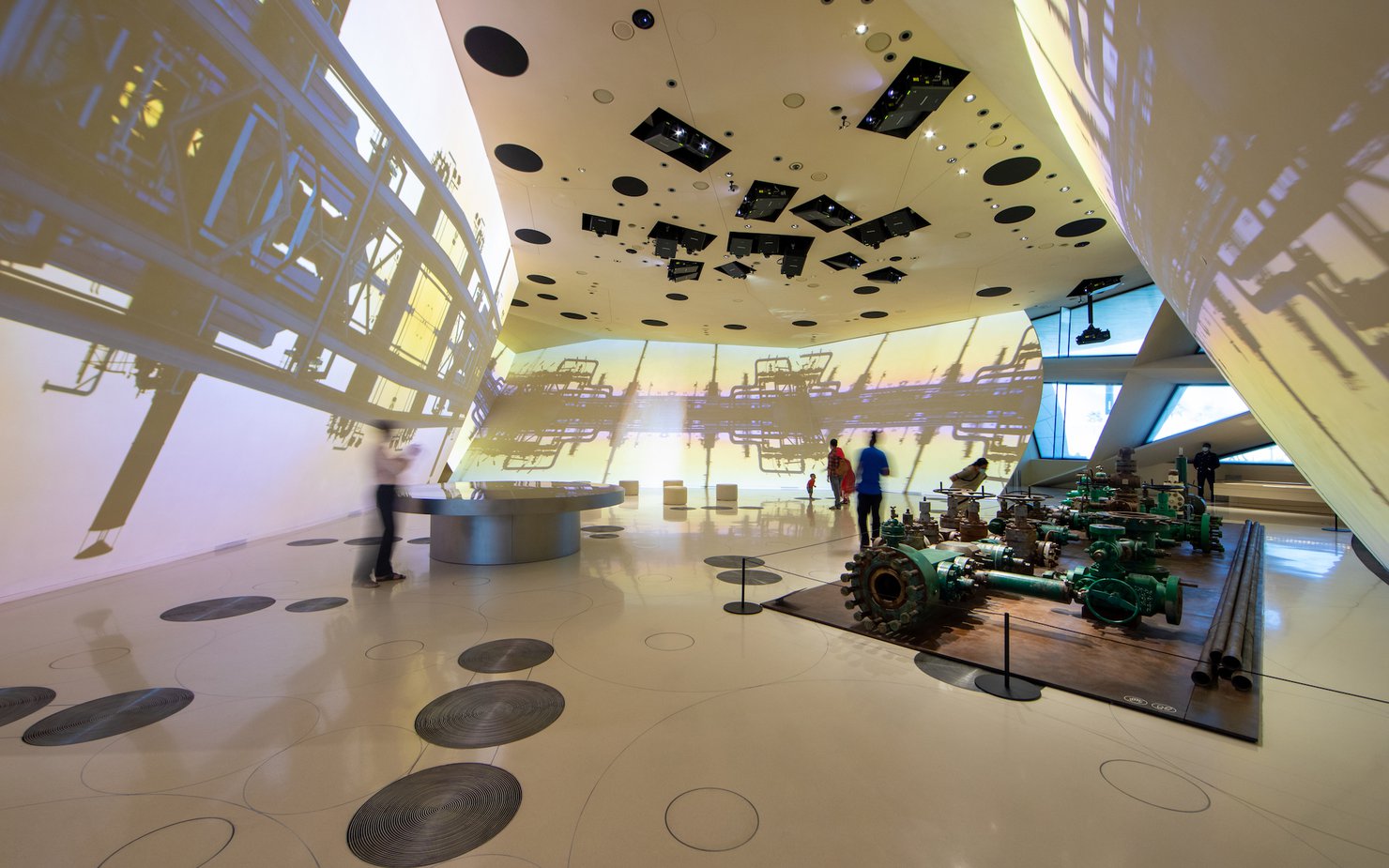 Interior of a gallery space at the National Museum of Qatar showcasing oil platform machinery