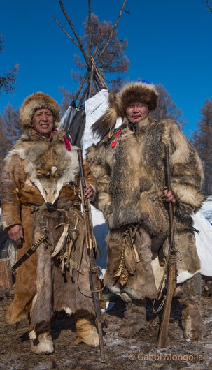 Two central asian tribesmen wearing animal fur clothes