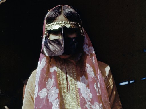 Woman wearing traditional Qatari dress and face covering