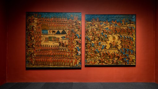 Two square paintings depicting war times in a gallery at the 'One Tiger or Another' exhibition