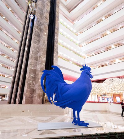An installation of Katharina Fritsch's larger than life blue cockerel, Hahn, at the Sheraton Hotel in Doha.
