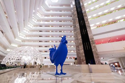 Blue cockerel sculpture placed in the interior of the Sheraton Hotel