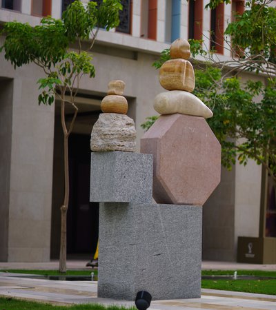 A large-scale geometric sculpture positioned in the center